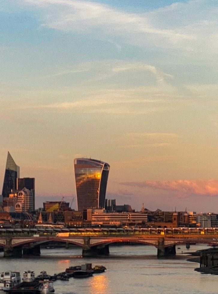 The London skyline over the Thames at sunset