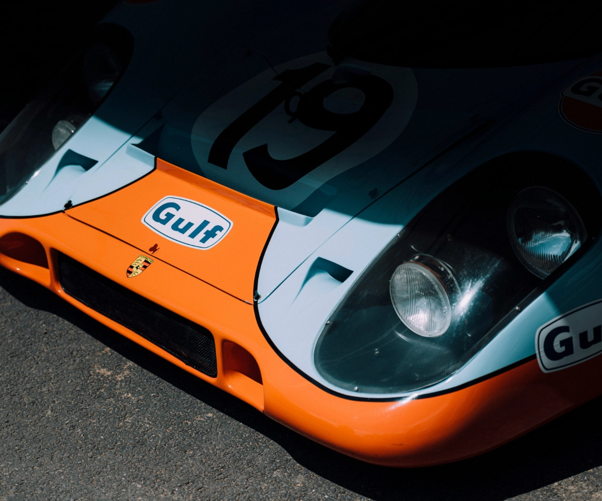 A vintage sports car in a garage at Goodwood