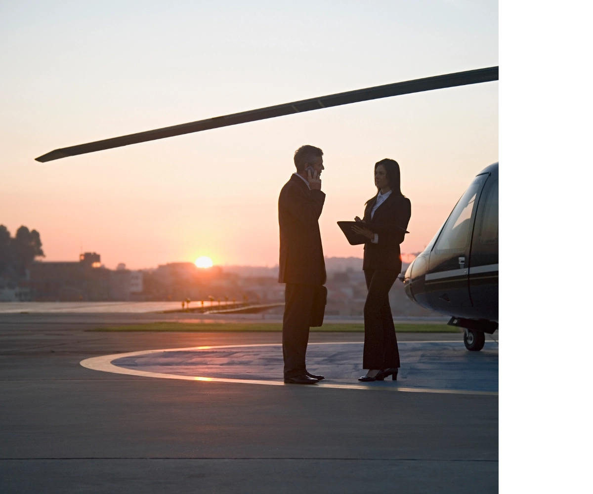 A businessman ready to get on to his private helicopter charter